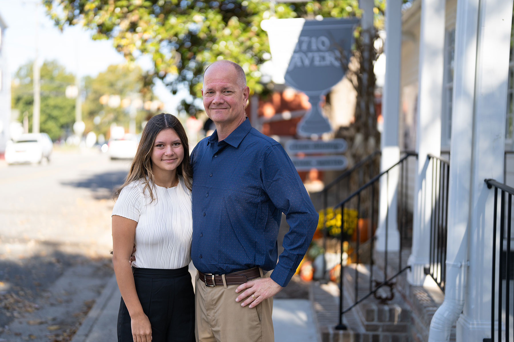 Business owners standing in front of tavern