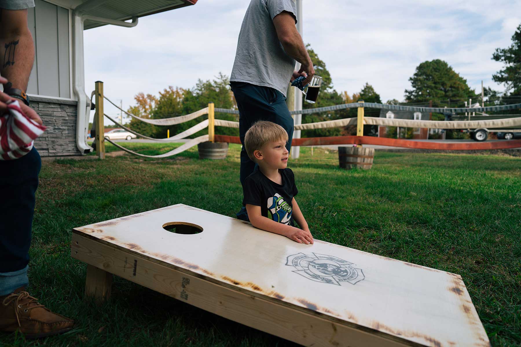 Boy playing cornhole