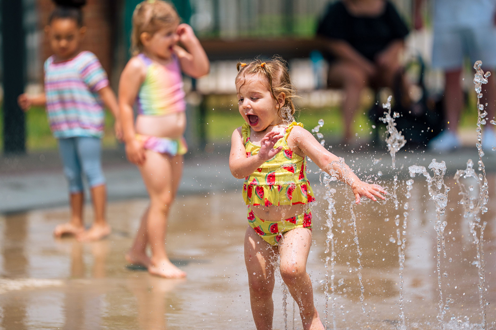 Kids having fun at the splash pad